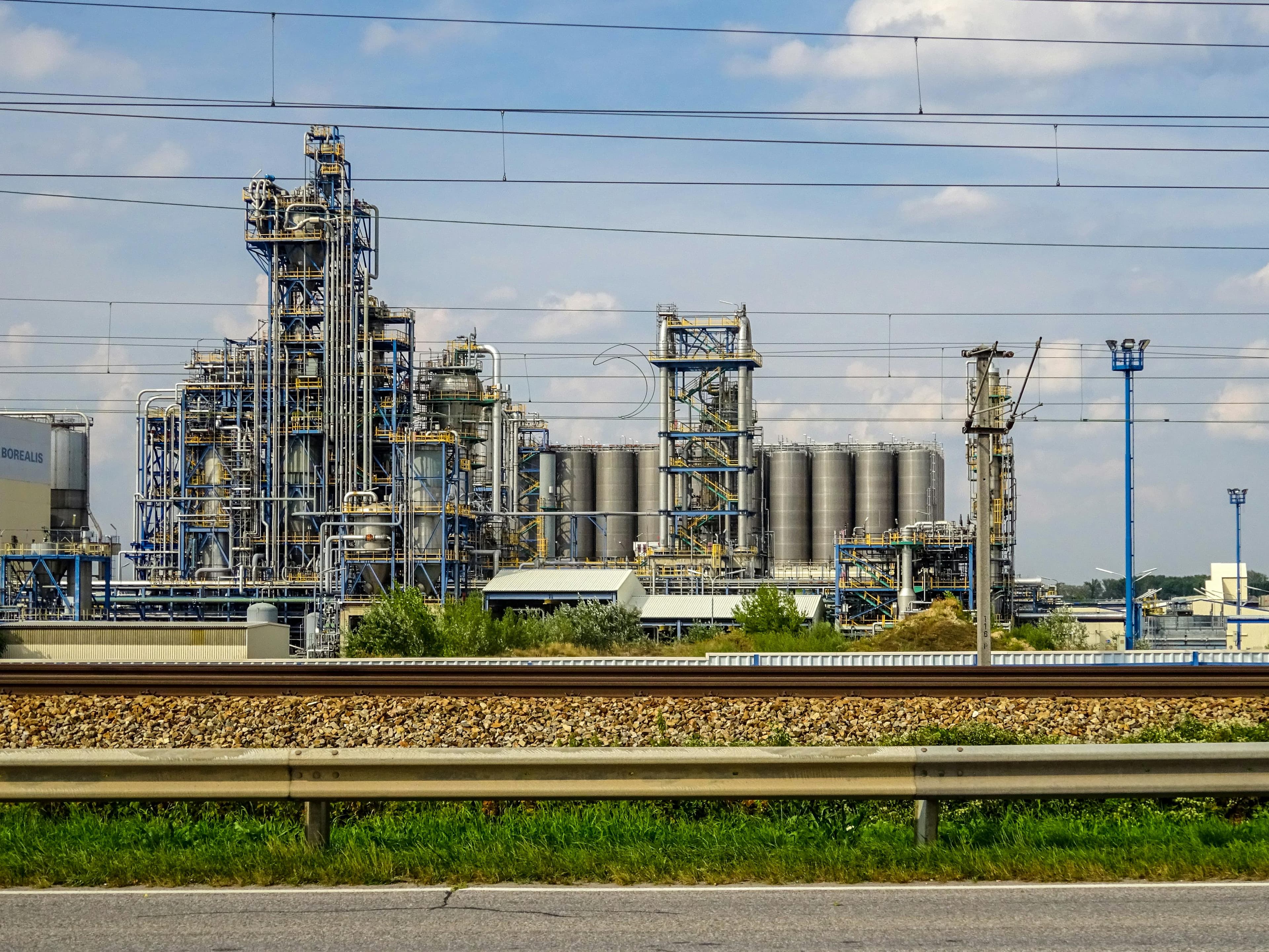 Industrial chemical processing facility with stainless process infrastructure